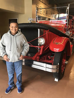 4 Reasons We Homeschool Year Round-Xander at Fire Museum