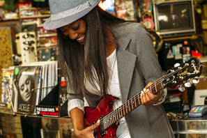 International Music Day - Lady playing guitar